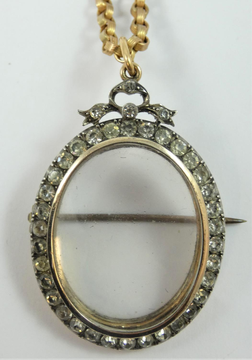 A 19th century paste and gold locket/brooch/pendant, bearing control marks, the silver set paste