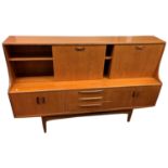 A G-Plan teak Fresco sideboard, circa 1960's, the upper section with drop down drinks cupboard to