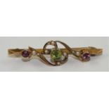 An Edwardian 9ct rose gold Suffragette Brooch, Chester 1911, the milligrain collet set peridot