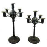 An Austrian Arts & Crafts iron candelabra, by Hugo Berger, c.1900, with twist stem, stamped