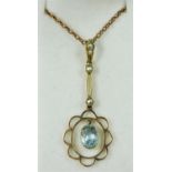 An Edwardian 9ct gold, aquamarine and pearl pendant, milligrain collet set with an oval mixed cut