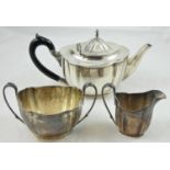 A silver three piece tea service, Sheffield 1937/38, of oval shaped form, comprising tea pot,