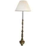 A brass standard lamp, with embossed cast stem, 150 cm.