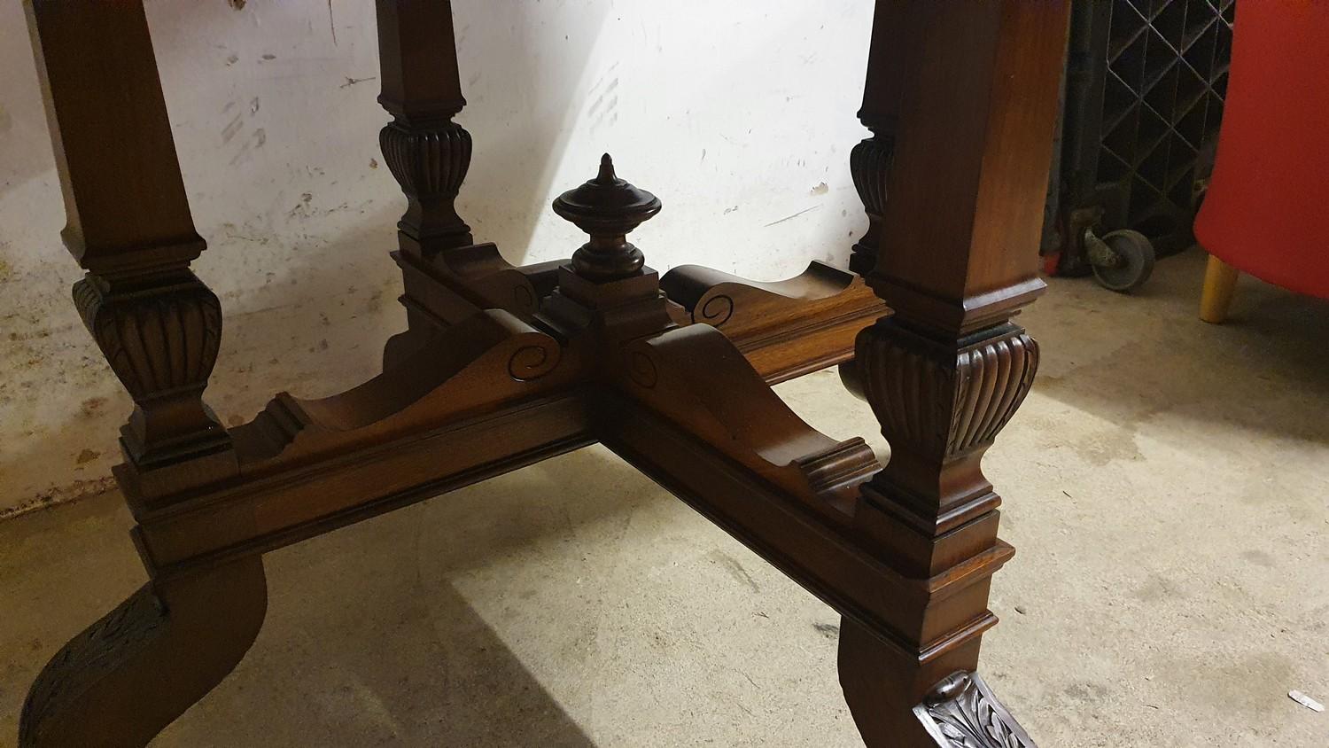 An Edwardian mahogany octagonal dining table, raised on four tapering supports with carved - Image 2 of 2