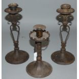 An Austrian Arts & Crafts iron pair of candlesticks, by Hugo Berger, c.1900, one stamped Coberg,