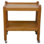 Rabbitman: A Peter Heap (Wetwang) English oak tea trolley, adzed, two tiers, chamfered legs, on