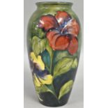 A Moorcroft Iris pattern inverted baluster shoulder vase, typically tube lined with flowerheads