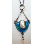 A Continental silver, enamel and blister pearl pendant, unmarked, c. 1905, with pearl drop below,
