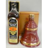 Bushmills Black Bush Irish Whiskey, 750 ml, box, together with Bells Christmas 1999 whisky, box (2).