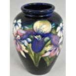 A Moorcroft Iris pattern inverted baluster shoulder vase, typically tube lined with flowerheads