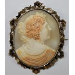 A Victorian gold mounted Bacchanalian lady, with pearl necklace, within a scroll frame, 7 x 5.5 cm.