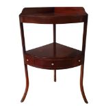 A 19th century mahogany corner washstand, the lower shelf with central drawer flanked by dummy