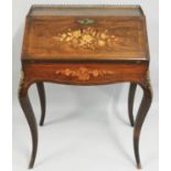 An Edwardian rosewood and inlaid Bonheur du Jour, the fall front with floral inlay, opening to