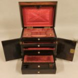 A Victorian ladies rosewood and mother of pearl compendium, of sarcophagus form with floral inlay