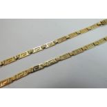 A gold fancy Greek Key pattern necklace, stamped 585, weight 14.5 gms.