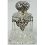 A Victorian cut glass and silver mounted scent bottle, Birmingham 1897, the hinged cover to a
