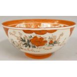 A Japanese Kutani porcelain bowl, decorated with birds and flowers, iron red border, character marks