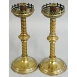 A Victorian pair of brass candlesticks, with fleur de lys capitals and twist stem, 32 cm.