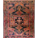 A Persian Heriz rug, the field with geometric and gul designs in multiple colours 307 x 146 cm