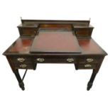 Maple & Co., London, a ladies mahogany writing desk, the leatherette fall front opening to reveal