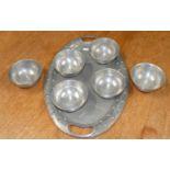 A set of six Tudric pewter bowls, stamped '6680', diameter 12.5cm, together with a Barkers studded