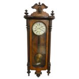 A Vienna style walnut wall clock, the two part dial with subsidiary seconds dial, the movement