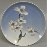 A Royal Copenhagen wall plate painted blossom, design no 2830 over 1125, 25 cm.