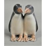 A Royal Copenhagen porcelain model of a pair of penguins, design number 1190, 9.5 cm.