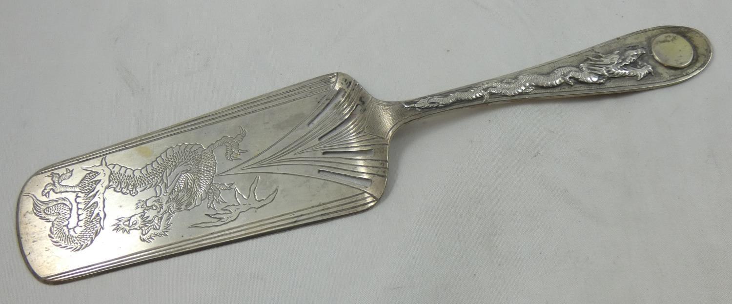 A Chinese silver slice, by Zee Sung, Shanghai, c. 1920, with cast dragon motif to the handle and