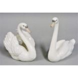 A pair of Lladro figures of swans, one with outstretched wings, impressed marks 'B-2E' and 'B-