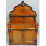 A Victorian mahogany chiffonier, the shaped back with shelf, over a serpentine frieze drawer, over