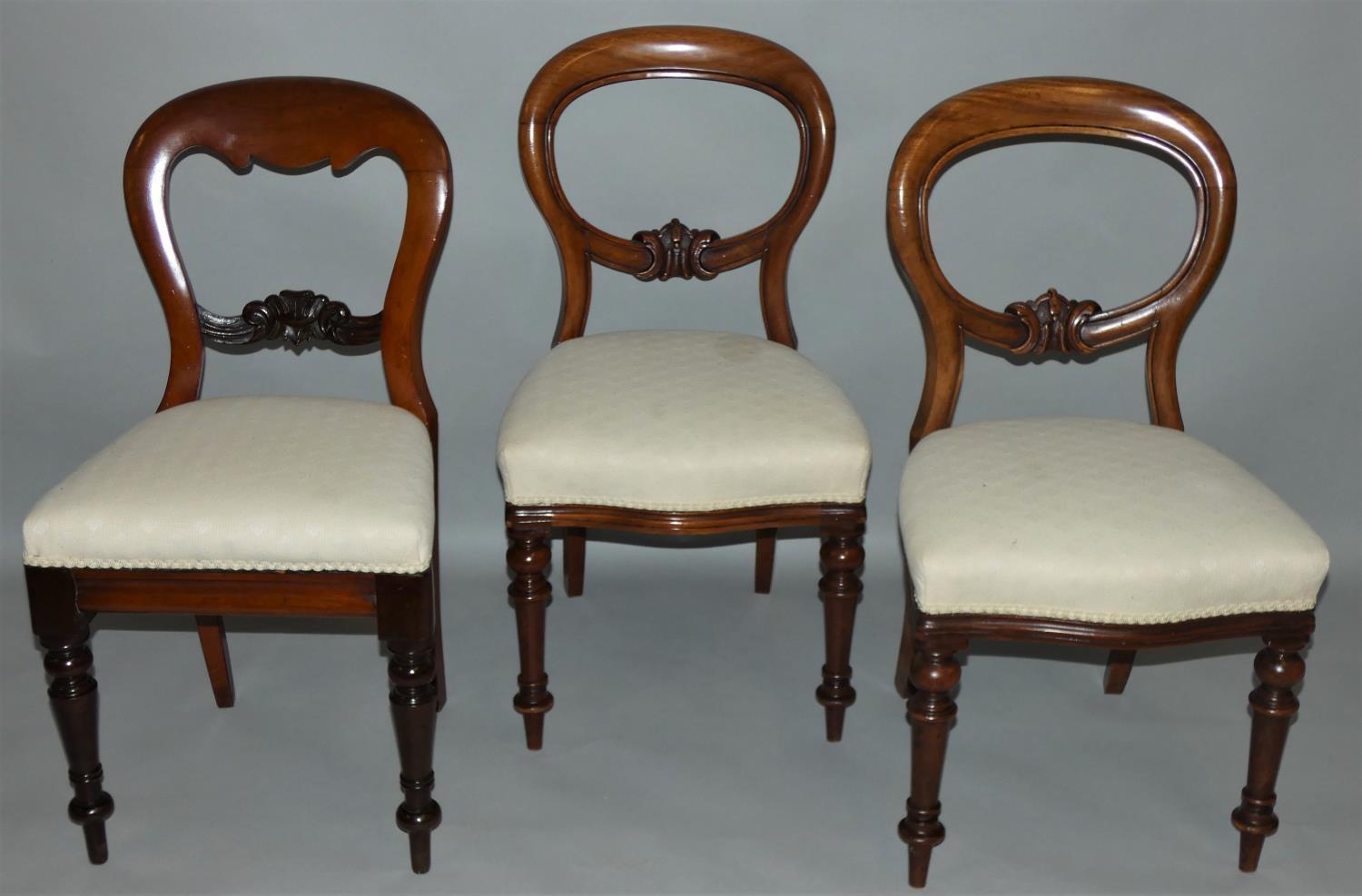A Victorian Harlequin set of eleven mahogany balloon back dining chairs, with matching upholstered