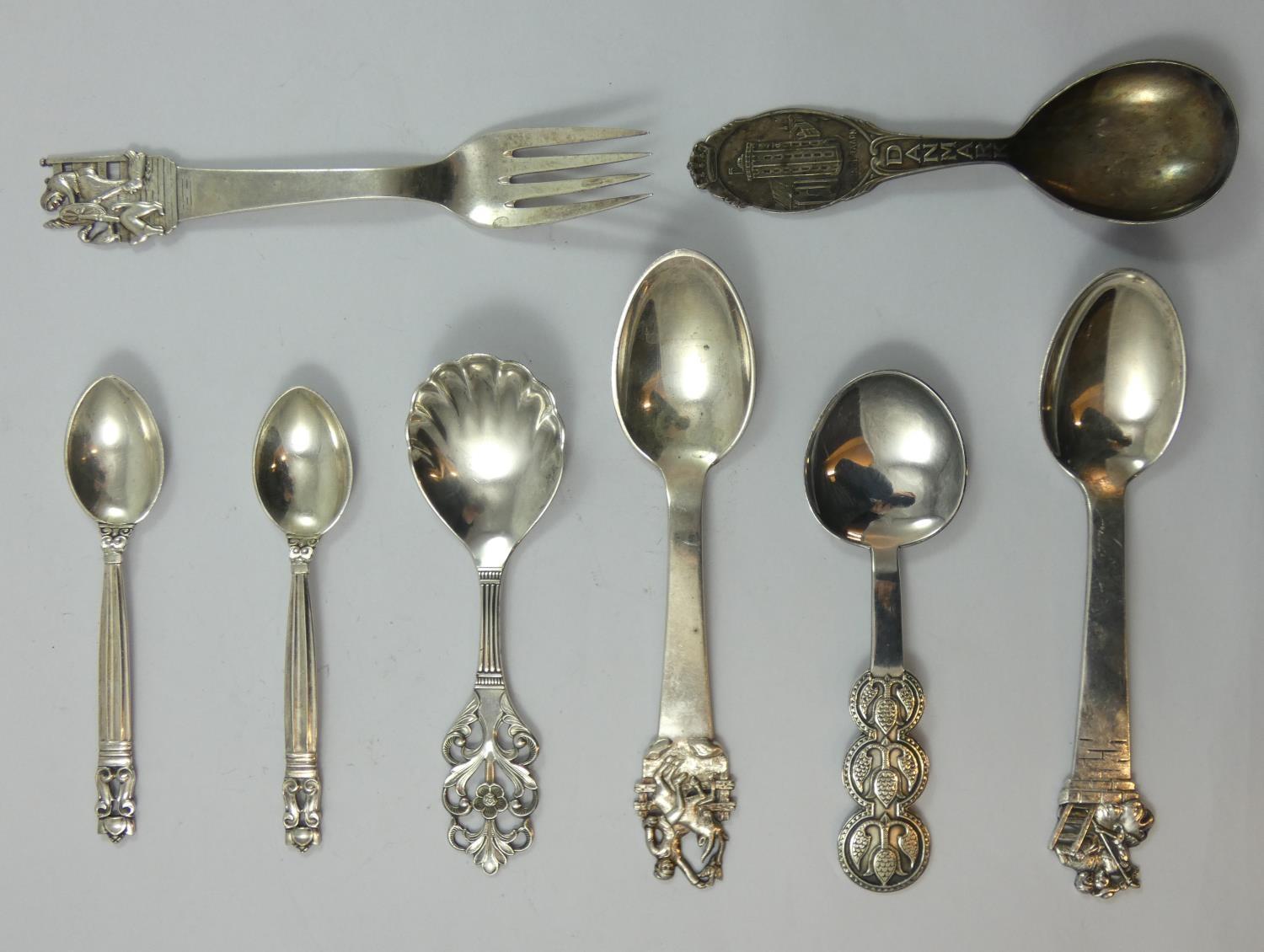 Georg Jensen, two acorn pattern tea spoons, London import 1928, a Danish silver caddy spoon, by