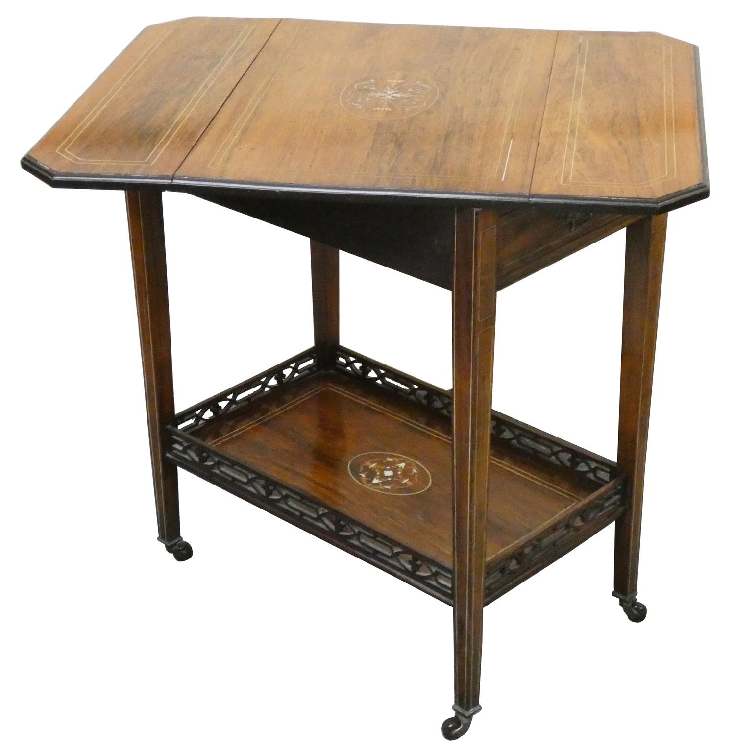 An Edwardian rosewood drop leaf side table, the rectangular twist top with boxwood inlay, single