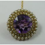 A Victorian gold amethyst and pearl cluster brooch, the circular mixed cut stone bordered by two