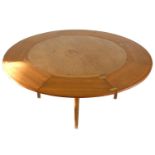 A Danish teak Flip Flap or Lotus Leaf circular extending dining table, manufactured by Dryland -