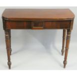 A Victorian mahogany fold over side table, with extending leg, tapering turned legs 90 x 45 cm