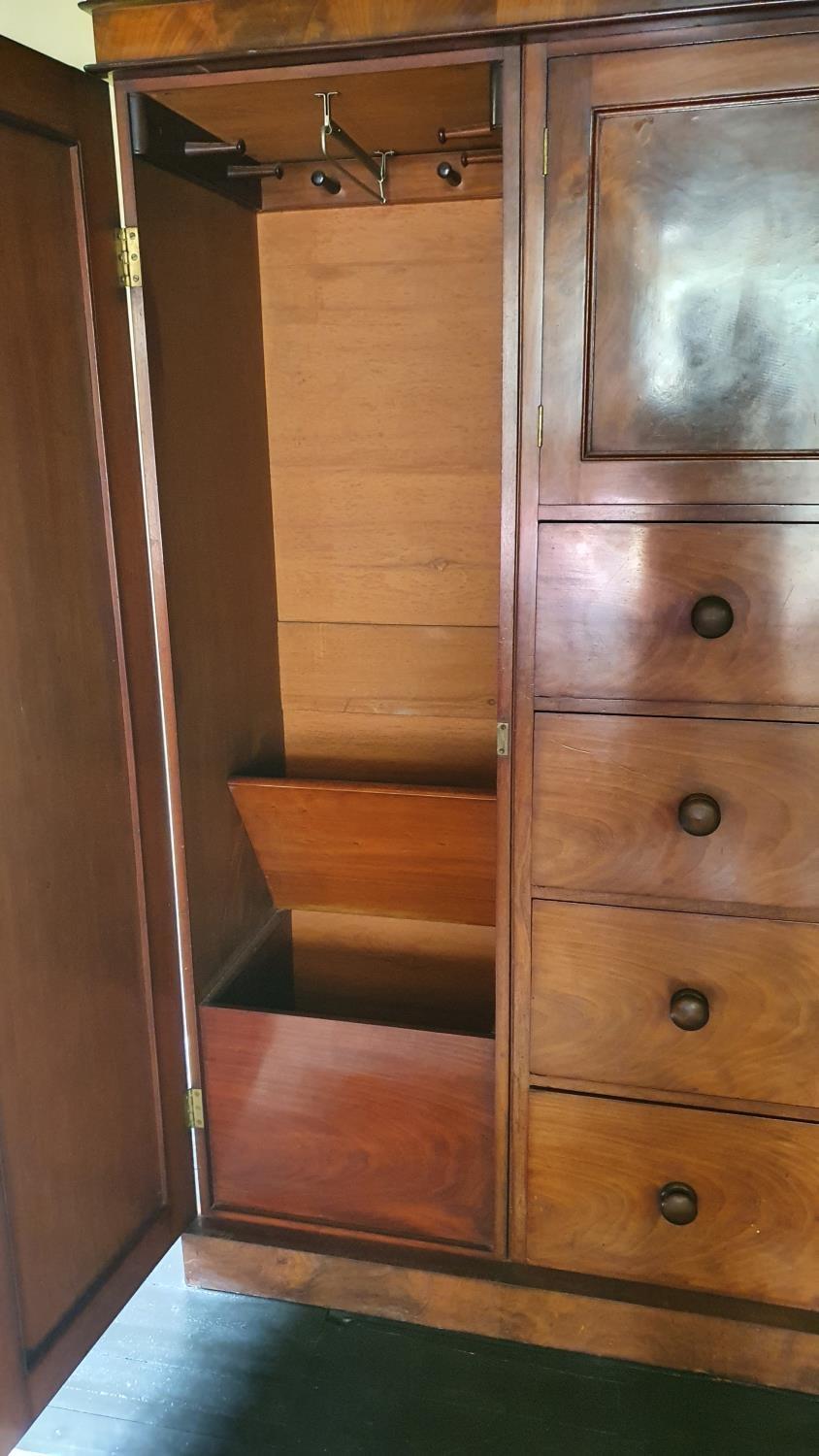 A 19th century mahogany wardrobe, the central cupboard over four graduated drawers, the right - Image 4 of 4