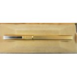 Dunhill, a gilt metal Gemline fountain pen, with engine turned body, 18K gold knib, warranty card,