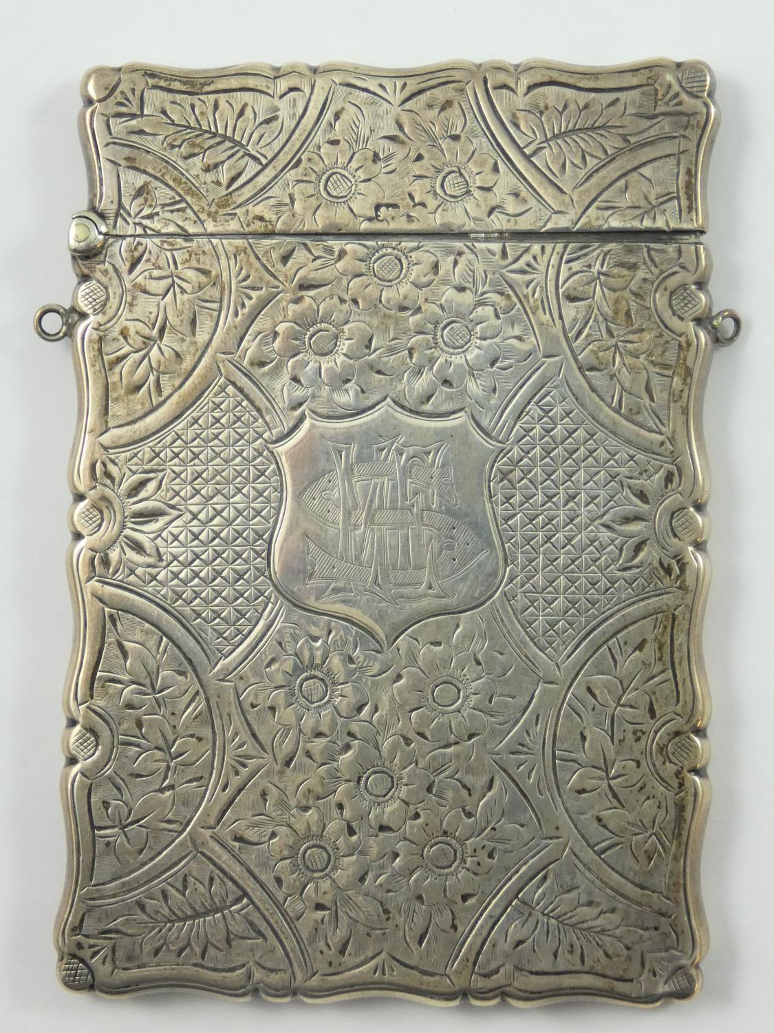 A Victorian silver card case, Birmingham 1900, with all over floral engraved decoration, 10 x 6.5