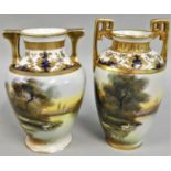 A pair of Japanese Noritaki baluster vases, decorated with swans on a lake, gilt handles, 20 cm.