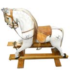 A Yorkshire Wooden Horse Company dapple grey rocking horse, born Christmas 1989, with real horse