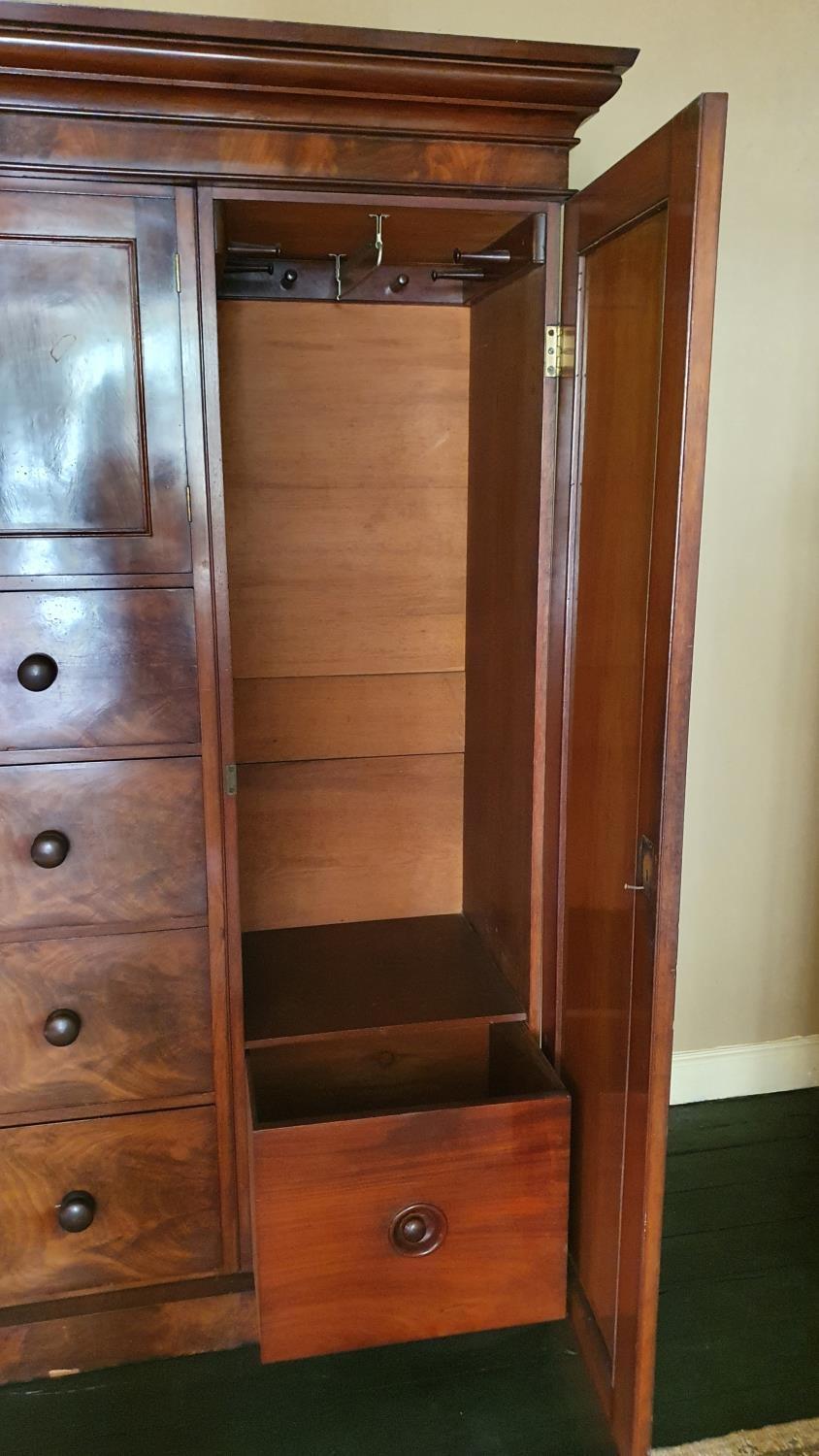 A 19th century mahogany wardrobe, the central cupboard over four graduated drawers, the right - Image 3 of 4
