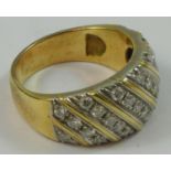 A gold and diamond dress ring, set with six rows of brilliant cut stones, approximately 0.75cts