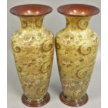 A pair of Doulton and Slater Chine style vases, with gilded decoration on a yellow textured