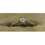 An 18ct gold single stone diamond ring, claw set with a brilliant cut stone, estimated to weigh 0.45