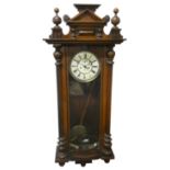 Gustav Becker, a Vienna style walnut wall clock, the two part dial with Roman numerals and