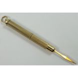 A 9ct gold toothpick, Birmingham 1989, with engine turned decoration, 6.5 gm.