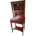 An Edwardian mahogany and boxwood inlaid display cabinet, the upper section with glazed door over