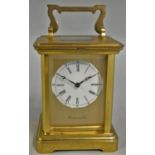 Richard & Cie, a French brass striking carriage clock, the white enamel dial with Roman numerals,